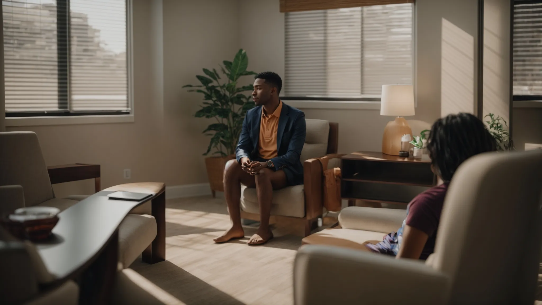 a person sitting in a therapy session with a counselor in cincinnati discussing personal goals and aspirations for sex therapy services.