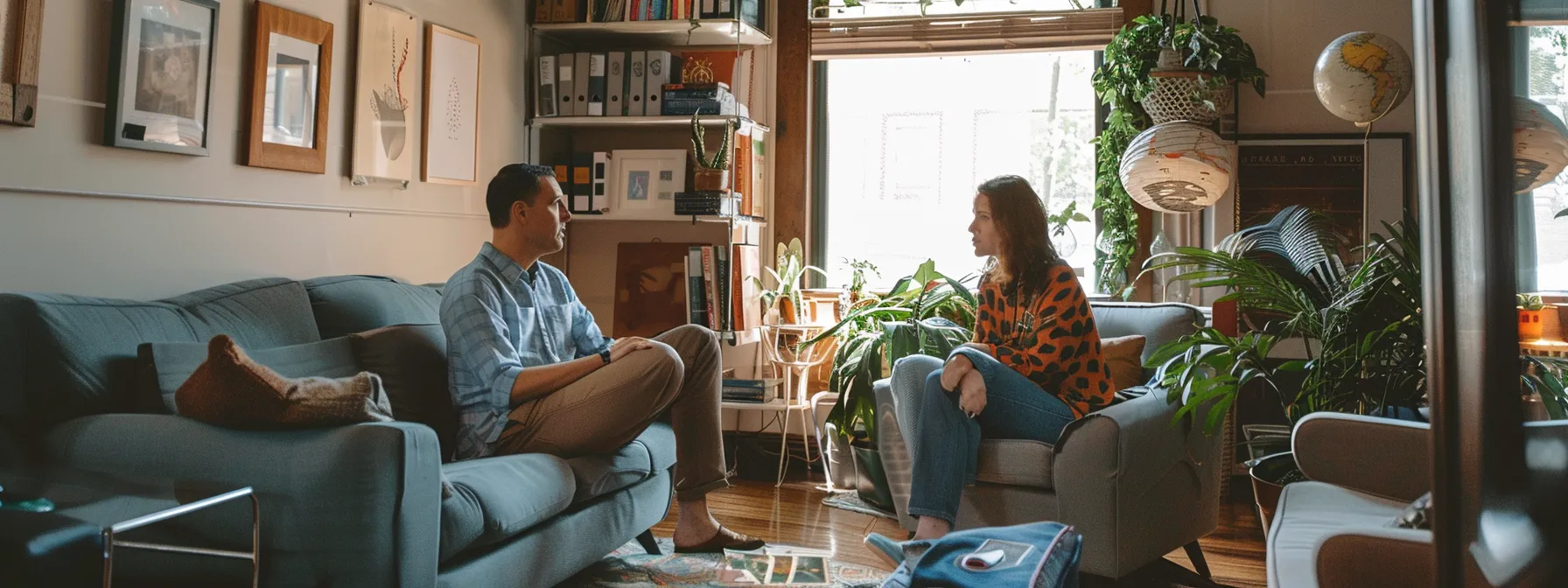 two people engaged in a serious conversation in a cozy therapy office in cincinnati.