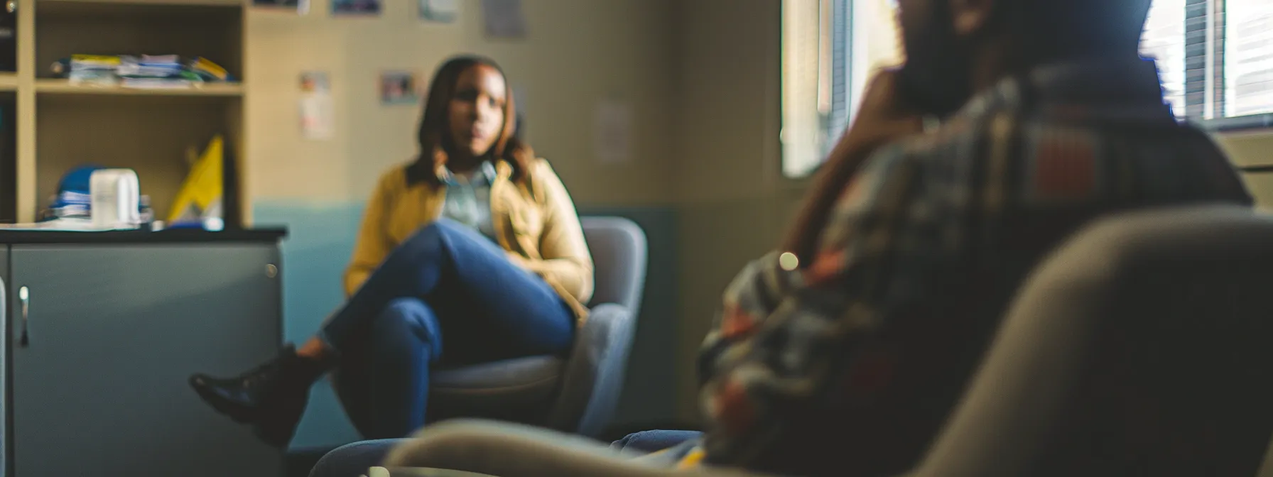 a person sitting in a cozy office, sharing their concerns with a therapist in cincinnati.